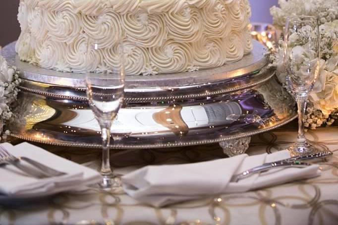 Four tier gold and white cake