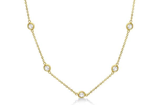 Diamond Station Necklace	Bezel set in 14k gold, 7 round 0.15ct to 4.00ct diamonds wrap halfway around this aristocratic station style necklace.