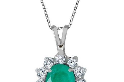 Emerald & Diamond Accented Pendant Necklace	A Lady Di-inspired solitaire style pendant featuring an oval cut emerald surrounded by 12 diamonds. Fully customizable.