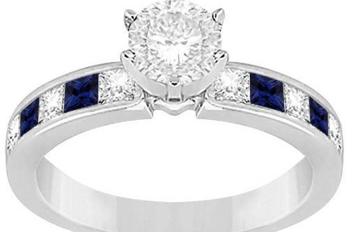 Channel Blue Sapphire & Diamond Engagement Ring	Princess-cut sapphires & diamonds channel-set in a gold or other precious metal band, surrounding a custom center jewel.