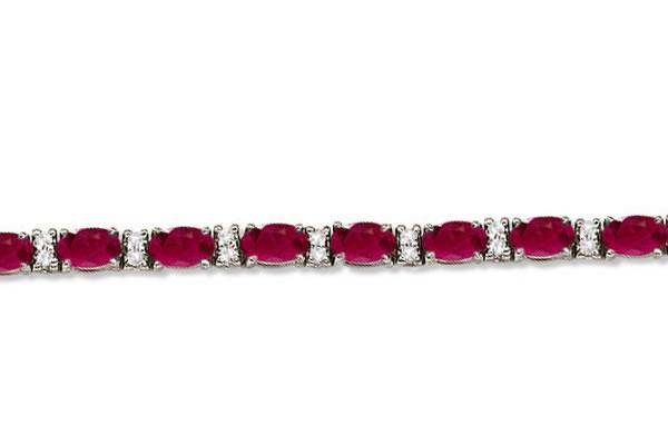 Diamond & Oval Cut Ruby Tennis Bracelet	24 oval rubies are accented by 50 brilliant cut round diamonds in this designer tennis bracelet. Custom gems available.