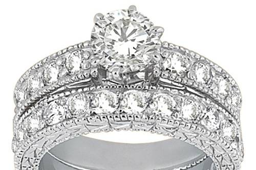 Antique Diamond Engagement Ring & Wedding Band 	With a total of 23 brilliant diamonds and a customizable center stone, this vintage bridal set is truly magnificent.
