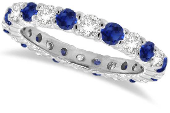 Blue Sapphire & Diamond Eternity Ring Band	Nineteen round cut sapphires and diamonds cover a band in your choice of precious metal. Alternate gems also available.