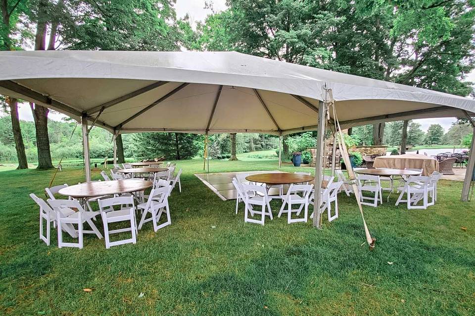 TENT WITH TABLES AND CHAIRS