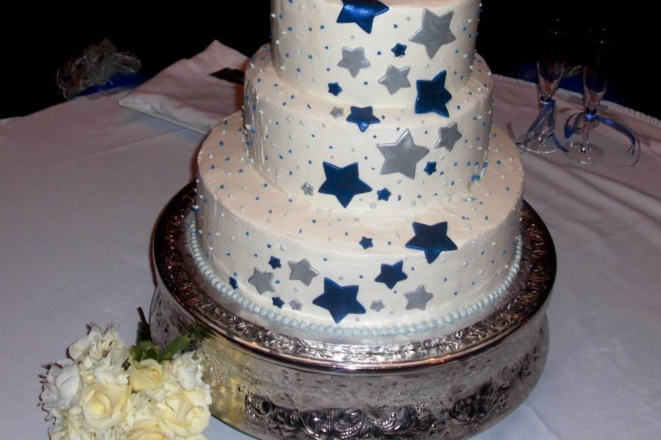 Starry Love.  Buttercream covered cake with fondant silver and blue stars.