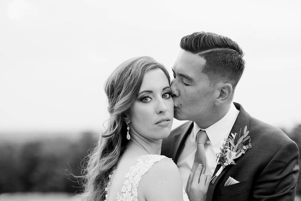 Groom kisses his bride