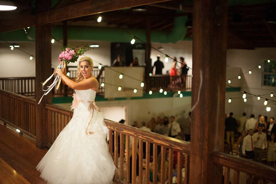 Bouquet toss at Vintage Gym