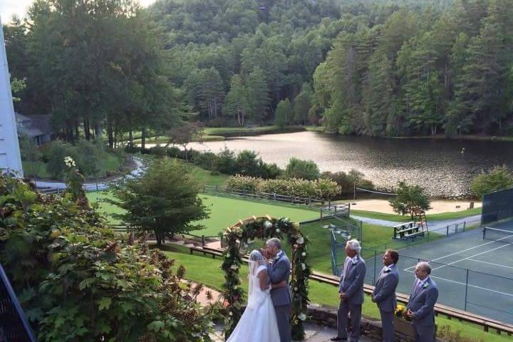 Stone patio wedding with the lake and mountain.  Perfect setting.