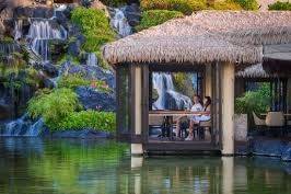 Couple sitting beside lake