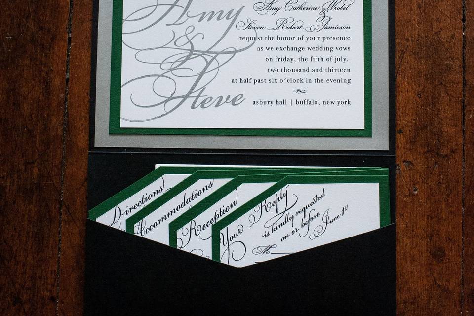 Black envelope and green ribbon