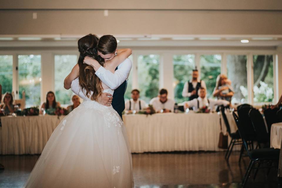 Newlyweds embrace as they dance
