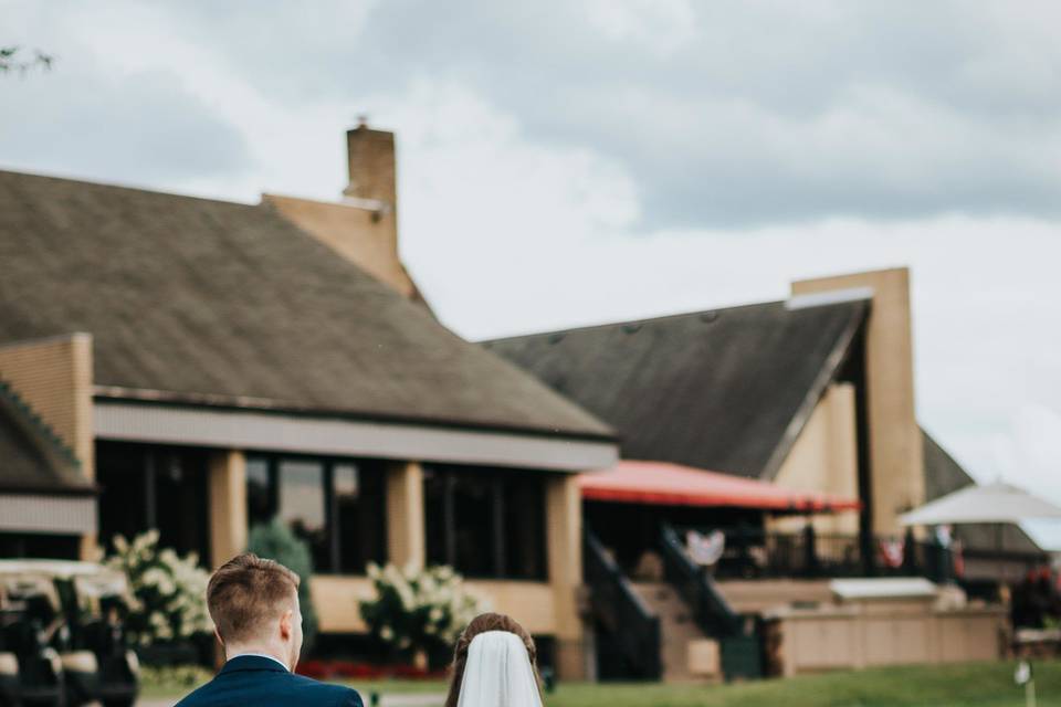 Newlyweds walking up the driveway