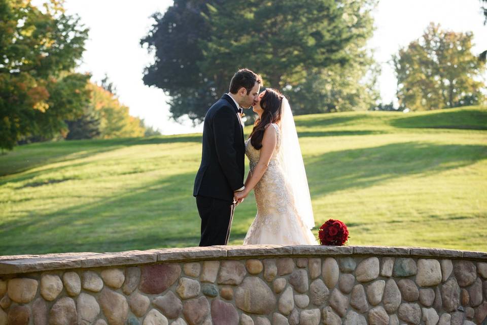 Newlyweds kiss on the bridge