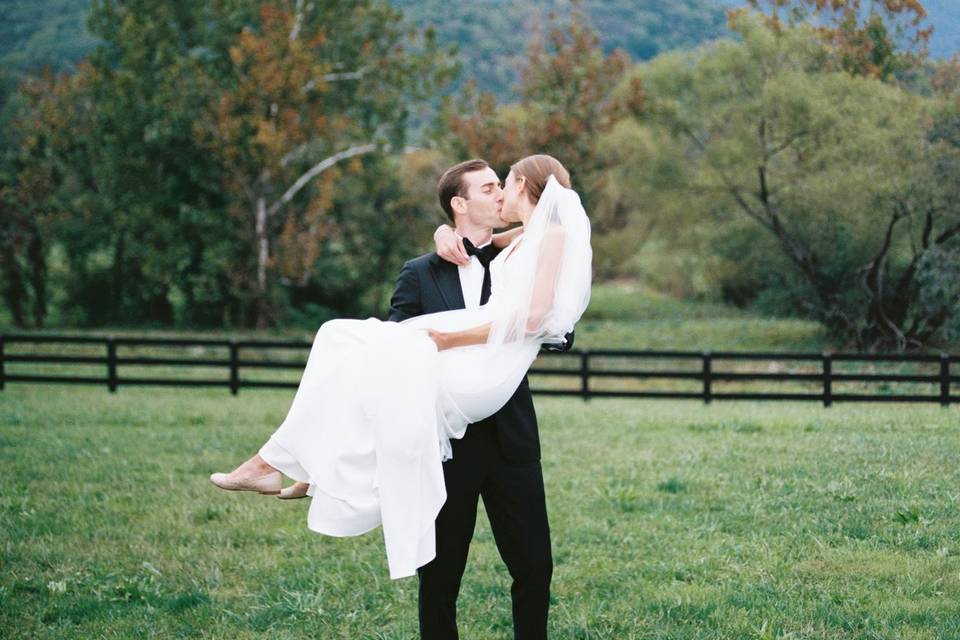 Groom Holding His Bride