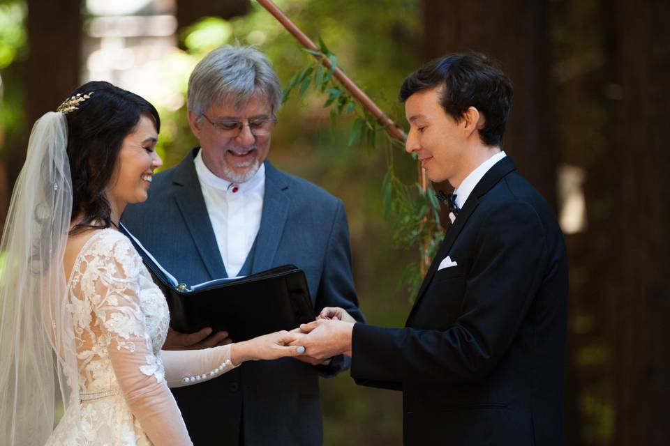 Groom placing the ring