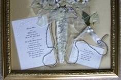 bouquet with invite, response card, boutonniere and the long strand of pearls that trailed from the wrapped stems