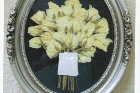 an all white rose bouquet displayed on black dupioni satin