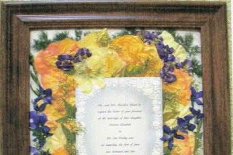 beautiful invite highlighted with blue delphinium, bouquet by 