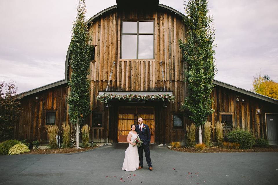 Couple in front of barn