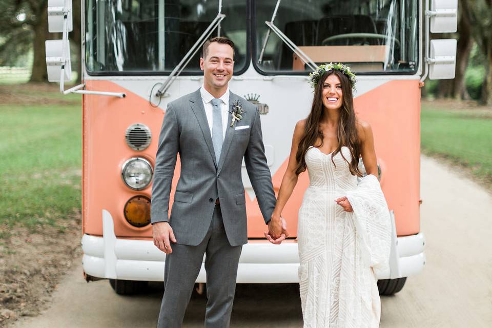 Newlyweds in front of the peach bus