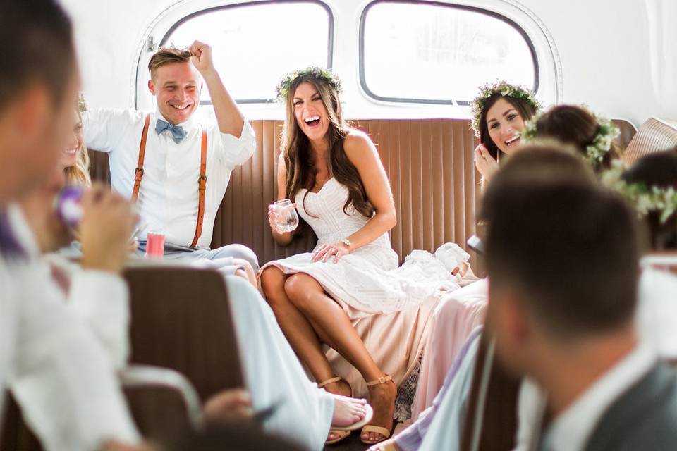 Newlyweds and their guests in the bus