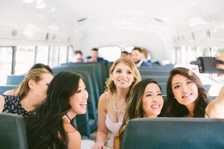 Bride and bridesmaids inside the bus