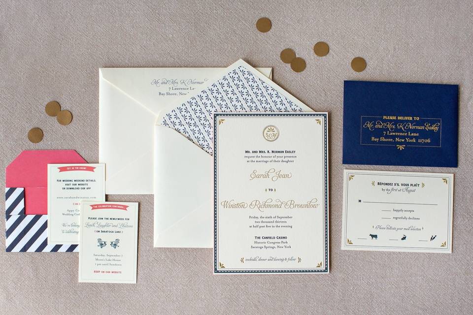 Gold, navy and coral wedding invitations