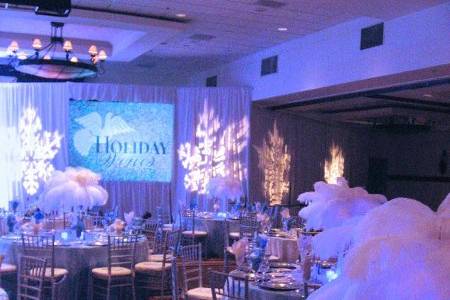 Winter Wonderland with White Ostrich Feather centerpiece on our Light Blue Taffeta with a White Passion Vine Organza Overlay