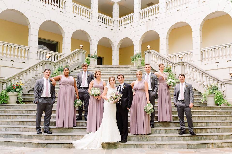 Newlyweds and their guests on the stairs