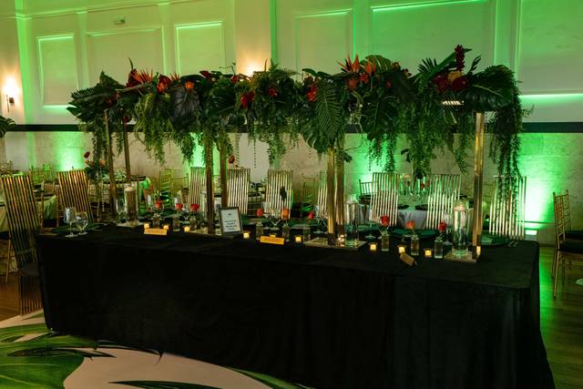 Green wash lighting over reception tables