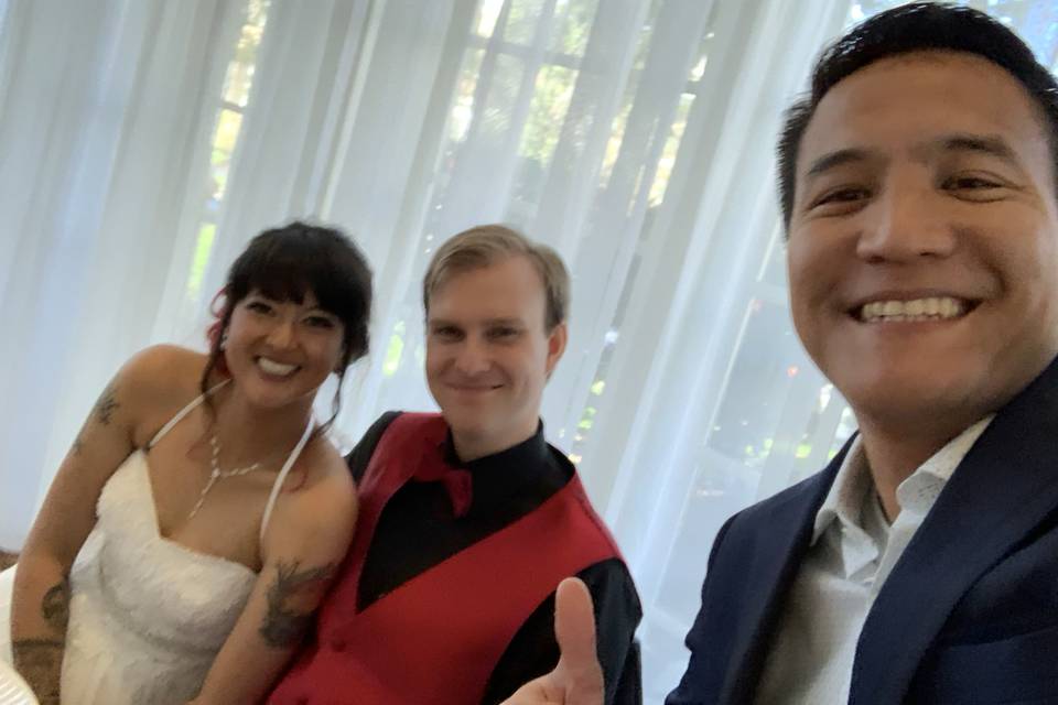 Happy newlyweds and DJ