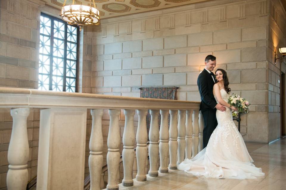 Couple in front of staircase