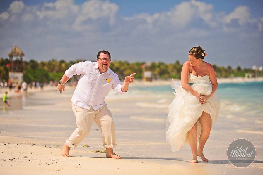Newlyweds dancing at the beach