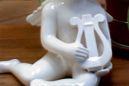 Ceramic angel with a lyre