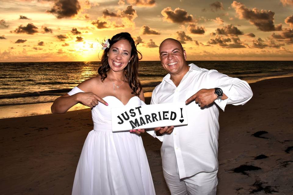 Newlywed couple at the beach