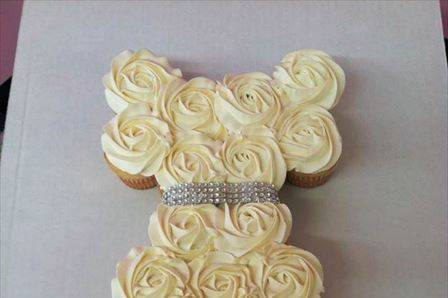 Wedding dress shape formed out of cupcakes