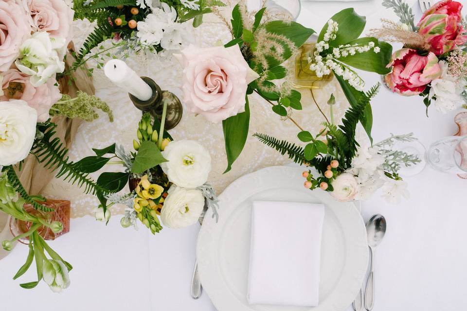 White table setup with flowers