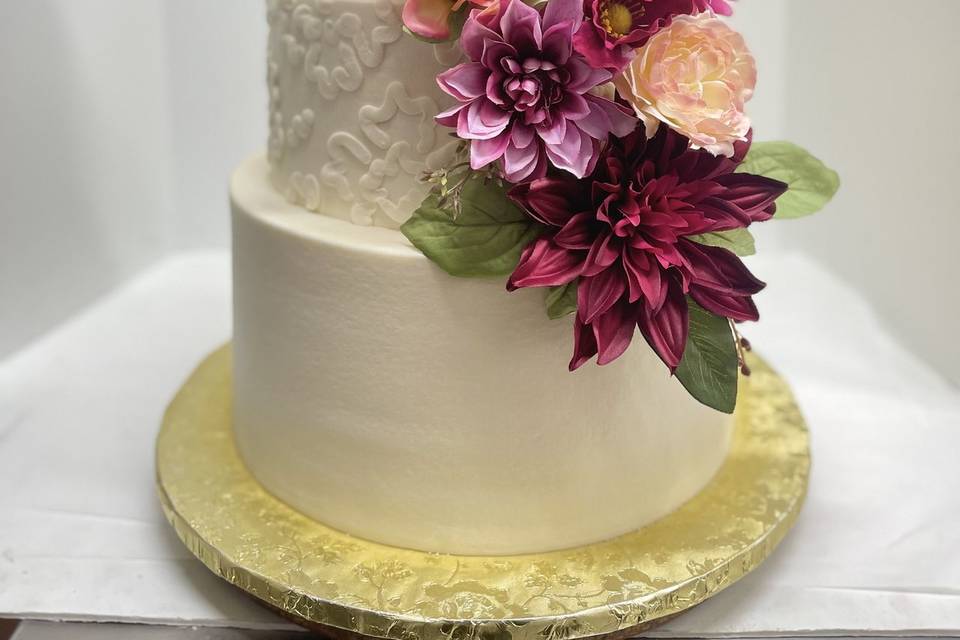 Vibrant blooms on wedding cake