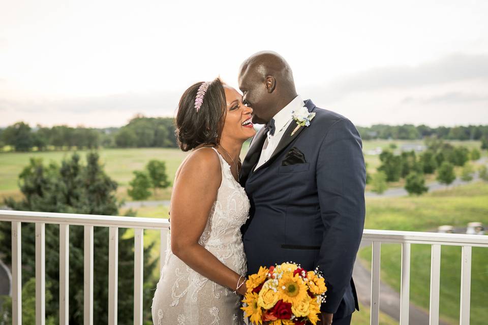 Groom telling a joke to bride