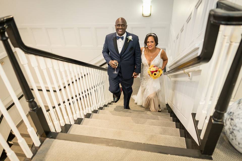 Bridegroom walking up the stai