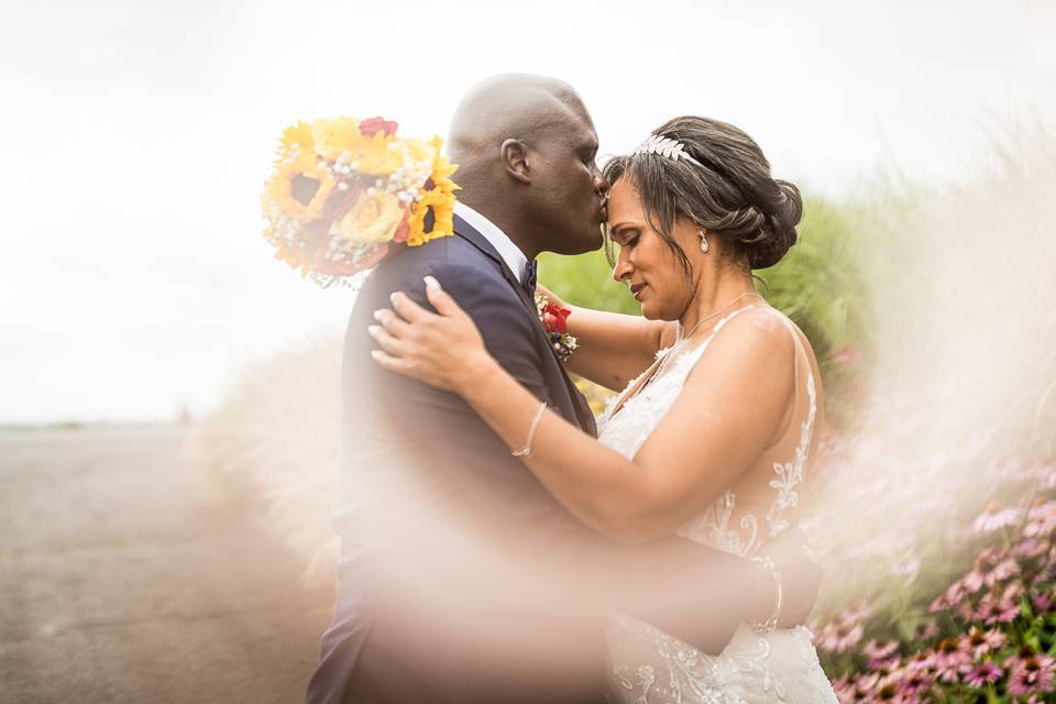 Groom, kissing the bride