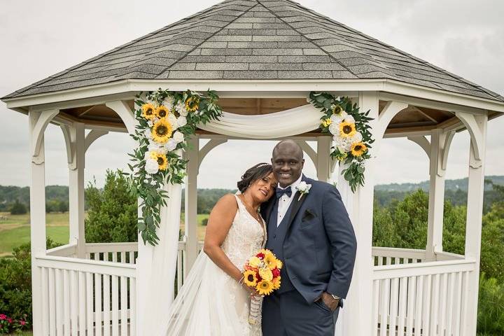 Brides head on groom shoulder