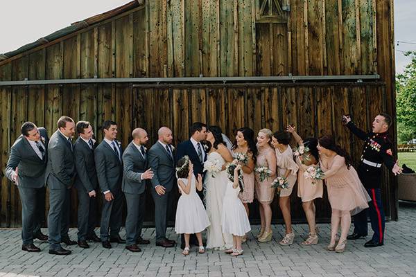 The couple with the bridesmaids and groomsmen