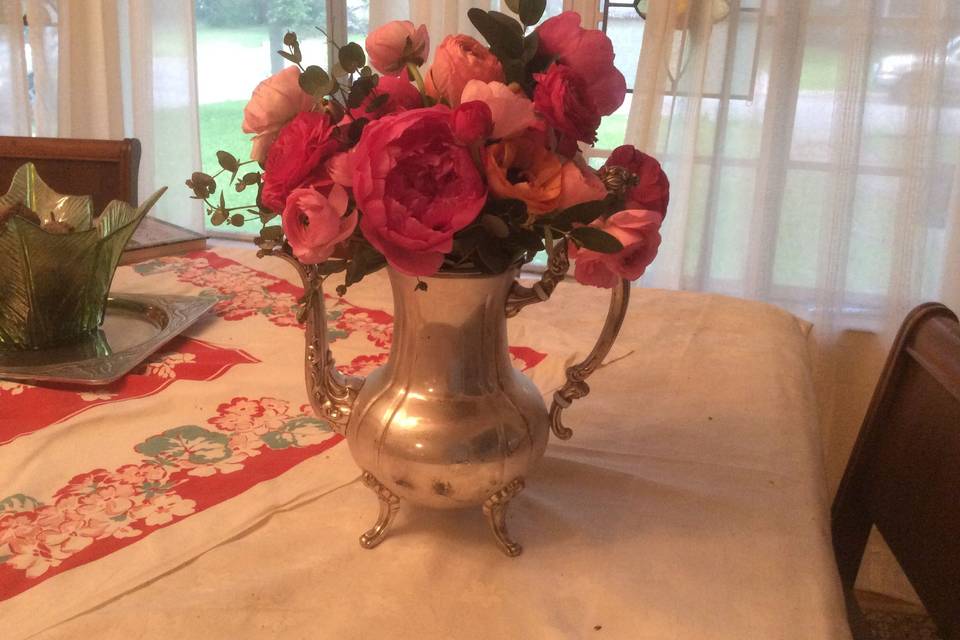 Red roses in a vintage vase