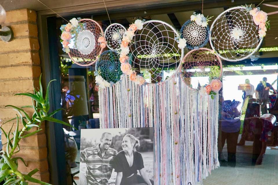 The perfect wedding back drop...this couple's colors were rose pink and blues with a boho chic vibes.
They opted for the multi-dream catcher collage, which they now have hanging above their bed