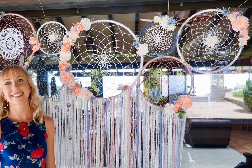 The perfect wedding back drop...this couple's colors were rose pink and blues with a boho chic vibes. They opted for the multi-dream catcher collage, which they now have hanging above their bed