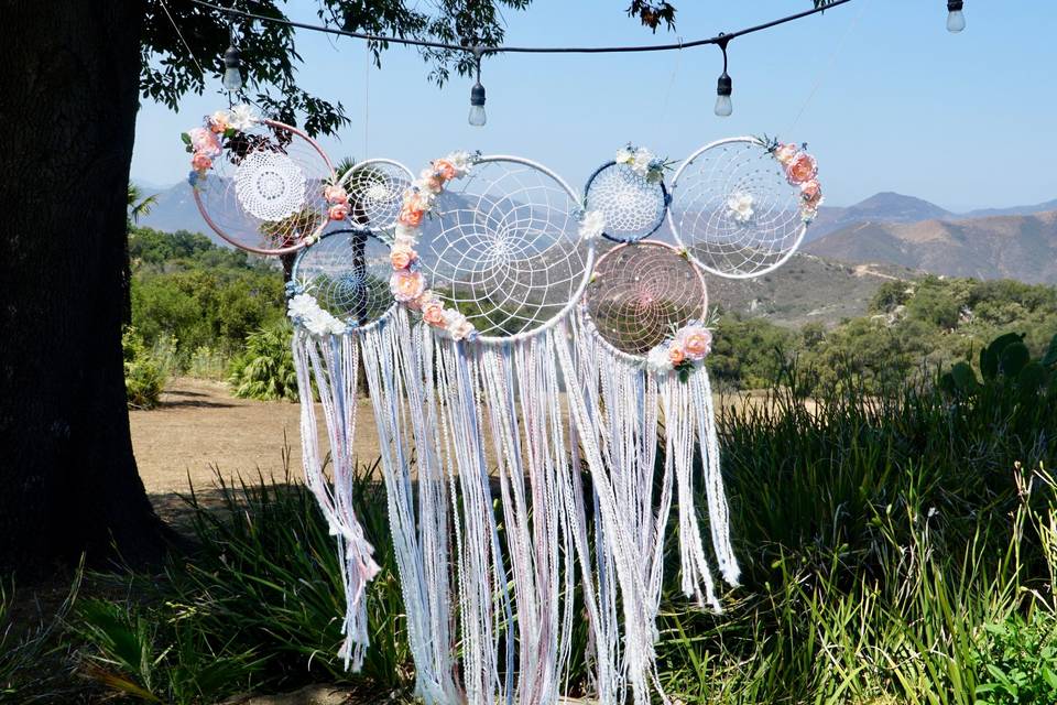 The perfect wedding back drop...this couple's colors were rose pink and blues with a boho chic vibes.
They opted for the multi-dream catcher collage, which they now have hanging above their bed