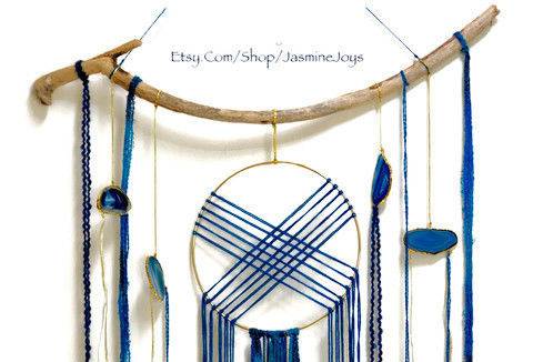 This was made for a couple wanted to incorporate geodes into a modern take on the dream catcher, in their wedding colors of navy blue and gold. They opted for several dream catchers to hang throughout their reception venue