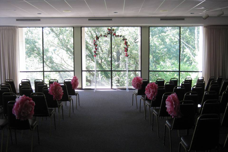 Beautiful wedding ceremony setup in the Salsbury Room at MacNider Art Museum. Minimal decorations needed with a view like that!