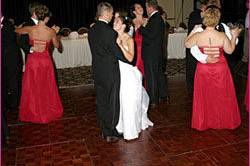 Couple and guests dancing